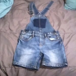 These are denim overalls for kids.